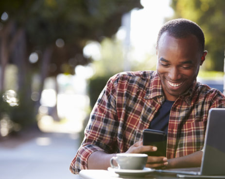 African young man with phone