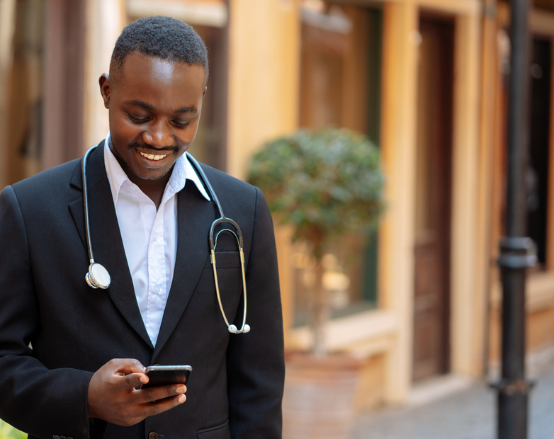 African doctor sending money via Mobile Money 